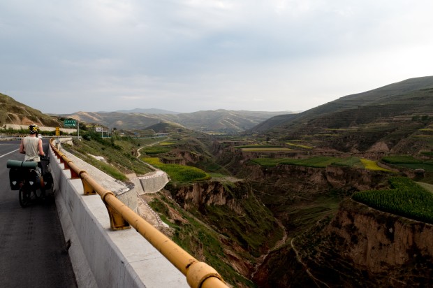 Stunning views from the bridges the Chinese have built straight through these valleys. Near Dingxi, Gansu, China.