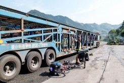 The police stopped us and wouldn't let us cycle though one of the tunnels. They put us on one of the empty lorries coming past. An unavoidable 22km of no cycling. Crossing into Shaanxi Province, China.